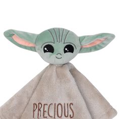 a baby yoda plush toy with the words precious on it's face and eyes