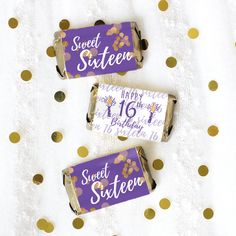 three purple and gold sweet sixteen candy bar wrappers with confetti on them