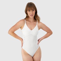 A sexy design that always brings the heat, this soft and seamless lace bodysuit is crafted with high-stretch fabric for a flexible fit you’ll love. The classic V-neck bodysuit features adjustable, convertible straps and wireless 2-ply cups for support and modesty. Detailed with a thong back, it is ideal for effortless layering. Whether worn solo or paired under your favorite jacket, its smooth finish guarantees a flawless look. Maidenform M: Because you deserve intimates as confident as you are. Elegant Fitted Lace Shapewear, Lace Shapewear Bodysuit Fitted, Fitted Lace Shapewear Bodysuit, Sleeveless Lace Bodysuit With Built-in Bra, Summer Stretch Bodysuit With Lace Closure, Fitted Lace Trim Shapewear, White High Stretch Shapewear, Fitted Underwire Bodysuit With Lace Closure, Lace Bodysuit With Lined Body For Summer