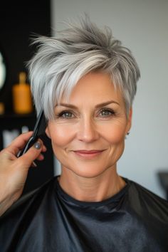 Click for More ➡️ | Save for Later ❤️  A shaggy pixie cut in a steel gray color, with choppy layers that add texture and movement. This style is perfect for those embracing their natural gray hair. (Shaggy Steel Gray Pixie - Short Pixie Hairstyles For Women Over 50) Womens Short Spiky Hairstyles, Short Choppy Grey Hair, Silver Hair Styles For Women, Short Pixie Grey Hair Over 50, Short Hair With Quiff Woman, Gray Streaked Hair, Color Tipped Hair, Gray Hair Short Over 50, Platinum Blonde Highlights And Lowlights Short Gray Hair