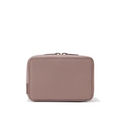 a small pink purse sitting on top of a white surface