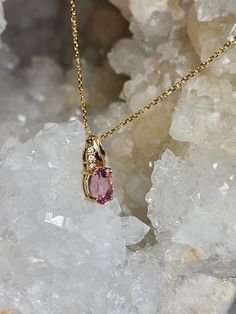 Lovely pink oval cut Tourmaline measuring 8.5x6.5mms set in 14K Gold with 3 natural accent diamonds. Pendant comes with matching 18" 14K Yellow gold chain. Oval Pink Sapphire Jewelry With Diamond Accents, Pink Oval 14k Gold Necklace, Oval Yellow Gold Necklace With Accent Stones, Yellow Gold Oval Necklace With Accent Stones, Elegant Oval Tourmaline Necklace, Oval Tourmaline Jewelry With Gemstone Accents, Oval Pink Sapphire In Yellow Gold Jewelry, Oval Pink Sapphire Jewelry With Gemstone Accents, Elegant Oval Tourmaline Pendant