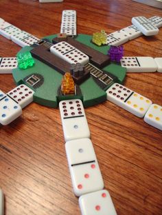 a board game with dices and dominos on the table