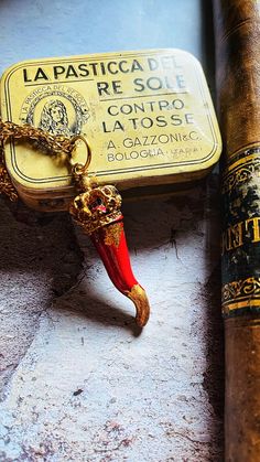 "Cornicello brings good luck unique in its kind because it is made entirely by hand giving its imperfect shape, as required by Neapolitan popular tradition. His design is in Bourbon style with a golden metal crown decorated with patina and gold leaf. The horn is made of ceramic and resin, it is hand painted with carmine red pigment and embellished with golden foil on the tip and in some parts of the horn based on inspiration. Its length is approximately 5/5.5cm/1.96\"/2.16 inches, but since each horn is handmade, the measurement is sometimes inaccurate, so please take this into consideration before ordering. The chain is golden steel, fine and simple with a length of 30cm/11.81 inches. It turns out to be a beautiful gift to give because it is designed by the artist based on the inspiration Traditional Red Jewelry For Good Luck, Artisan Red Necklace For Gift, Handmade Red Jewelry For Souvenir, Artisan Red Jewelry Gift, Symbolic Red Jewelry As Gift, Unique Red Jewelry With Charms, Handmade Spiritual Necklaces As Souvenir, Spiritual Handmade Necklaces As Souvenirs, Antique Red Engraved Necklace