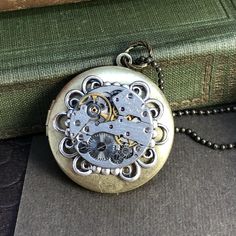 Ashley, Round Filigree Locket #Steampunkjewelry #vintagewatch #VictorianMagpie #victorianstyle #antiquejewerly Elegant Steampunk, Frame Highlights, Watch Locket, Moon Goddess Necklace, Filigree Frame, Industrial Steampunk, Industrial Jewelry, Round Watch, Goddess Necklace