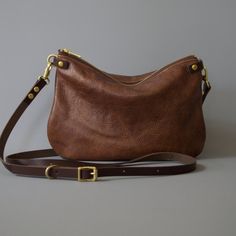 Soft Italian leather crossbody bag - ISLA - Handy Bag size Effortlessly stylish minimalist leather shoulder purse. Optional strap choice and internal lining choice. MEASUREMENTS : Width 10 inches (26cm) at the top 11 inches (29cm wide at widest point 8 inches / 20 cm tall Made with the most supple luxurious WALNUT coloured Italian leather. Choose your strap length and choose to have lined or unlined interior. DETAILS Super squishy Italian genuine leather YKK metal zip Solid brass hardware Lining Soft Leather Crossbody Bag, Easy Cross, Minimalist Bag, College Bags, Simple Leather, Leather Crossbody Purse, Day Bag, Leather Tassel, Everyday Bag