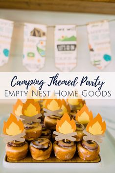 camp themed party empty nest home goods on a plate with paper fire hats and marshmallows