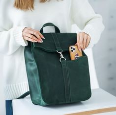 Spruce Up Your Everyday with a Stylish Green Leather Backpack 🌿 Looking for a versatile and chic bag to conquer your day? Look no further than our charming green leather backpack! This compact beauty is the perfect blend of style, functionality, and everyday comfort. 🎒✨ Choose Your Perfect Fit: Available in three sizes: Small (S): Ideal for everyday essentials - 26 x 21 x 8.5 cm (10.3 x 8.3 x 3.4 in). Perfect for an iPad 10.5". 📏 Large (L): Accommodates laptops up to 13 inches - 34 x 25 x 10 Leather Backpack With Removable Pouch For Everyday, Rectangular Leather Backpack For Everyday And Back To School, Leather Backpack With Removable Pouch For School, Everyday Leather Backpack With Removable Pouch For School, Everyday Rectangular Leather Backpack For Back To School, Green Leather Backpack With Large Capacity For Everyday, Green Leather Backpack With Large Capacity, Trendy Green Leather Backpack For Everyday, Large Capacity Green Leather Backpack For Everyday Use