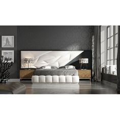 a modern bedroom with black walls and white furniture