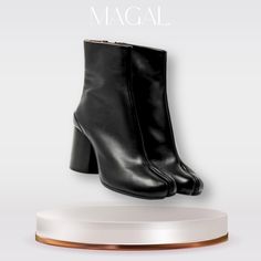 Step into sophistication with our Elegant Tabi Leather High Boots. Inspired by timeless design, these boots are a must-have for any fashion enthusiast. Crafted from premium quality leather, they offer both durability and comfort. The unique Tabi split-toe feature adds an edgy yet elegant touch, making these boots a standout piece in your collection. Perfect for pairing with any outfit, they're versatile enough for a day at the office or a night out. Elevate your style with these chic and timeless Tabi boots. Leather Boots With Sculpted Heel For Winter, Winter Leather Boots With Sculpted Heel, Leather Heeled Boots With Sculpted Heel For Winter, Winter Leather Heeled Boots With Sculpted Heel, Classic Leather Platform Boots For Winter, Classic Leather Winter Platform Boots, Modern Leather Sole Boots For Winter, Modern Boots With Leather Sole For Winter, Winter Ankle-high Heeled Boots With Leather Lining