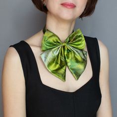 "Green silk bow tie for women and men Allow us to introduce our exquisite collection, featuring a silk bow tie that effortlessly blends timeless style with a touch of nature's allure. Our Green Tie collection embraces the evergreen charm of nature, captivating those who seek a blend of fashion-forward design and eco-consciousness. Handcrafted from the finest natural silk, each bow tie showcases an array of captivating hues, with hints of lush green that evoke a sense of freshness and vitality. Step into a world where luxury meets exceptional craftsmanship. Explore our collection of silk bow ties, designed for both men and women who appreciate the art of refined dressing. Whether you're attending a formal event, adding a touch of elegance to your daily ensemble, or looking for a one-of-a-ki Womens Bow Tie, Ties For Women, Bow Ties For Men, Wedding Bow Tie, Tie Collection, Green Bow Tie, Tie Bow Tie, Tie For Women, Tie Necklace