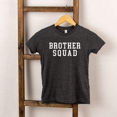 Looking for a cute tee for your kids? We have the perfect Brother Squad graphic tee addition to their closet! Also available in youth tees. Trending Graphic Tees, Kids Clothes Boys, Top Graphic Tees, Toddler Tees, Tee Shop, Boy's Clothing, Sleeve Styles, Top Shirt, Short Sleeve Tee