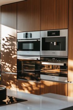 Minimalist Japandi kitchen design featuring stainless steel matte black white tones uncluttered aesthetic intuitive controls