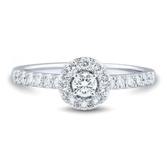 a white gold engagement ring with round diamonds on the band and shoulders, set in 18k white gold