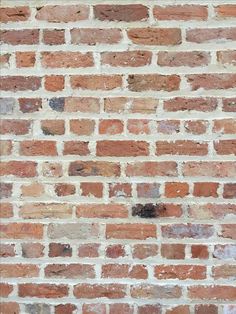 an old brick wall is shown in this image