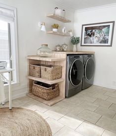 a washer and dryer sitting in a room next to a shelf filled with baskets