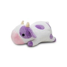 a purple and white stuffed animal laying on top of it's side with horns