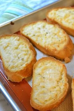 four pieces of bread sitting on top of a pan