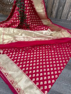 Rosy red vegan silk Banarsi saree with dense gold zari butas and a grand palla! Blouse fabric included. Fall attached. Note: The color of the products may slightly vary according to the lighting conditions and the color calibration of the viewing LED devices. If you would like more clarity before your purchase, please drop us a message . Red Banarsi Saree, Silk Banarsi Saree, Banarsi Saree, Pinkish Red, Color Calibration, Blouse Fabric, Halloween Shopping, Bathing Beauties, Saree