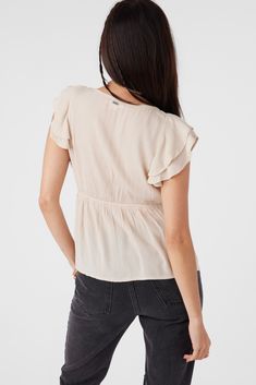 Light and breezy woven top that has a v-neck design, flutter sleeve detail and solid color wash. O'Neill Women's woven short sleeve top Regular length Flutter sleeves and hemline Encased elastic at neckline and waist 100% Viscose Crinkle | O'Neill Women's Deji Solid Flutter Sleeve Top in Cement, Size Medium, Viscose Playful Organic Cotton Short Sleeve Tops, Faded Soft-washed Short Sleeve Tops, Relaxed V-neck Beach Top, Soft-washed Organic Cotton Short Sleeve Tops, Relaxed Fit Rayon V-neck Top, Girl Beanie, Spring Suit, Woman Weaving, Denim Sweater