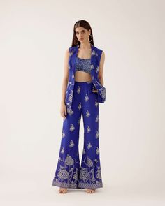 The embroidered Manali Set consists of a vest, bra top, and flared pants. For a custom color order, please email hello@sani.co. Chic Embroidered Festive Sets, Fitted Pant Set With Intricate Embroidery For Party, Chic Festive Sets With Floral Embroidery, Elegant Festive Pant Set With Matching Pieces, Elegant Matching Pant Set For Festive Occasions, Elegant Festive Matching Pant Set, Chic Fitted Festive Set, Chic Festive Fitted Sets, Fitted Embroidered Pant Set For Party