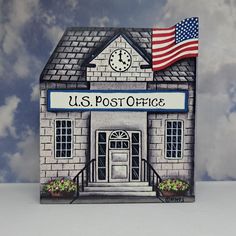 a post office with an american flag on top