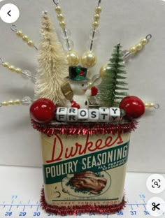 a tin can with christmas decorations on it