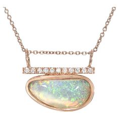 A breathtaking green opal shimmers with charm in the Head in the Clouds Crystal Opal Necklace No. 16. The crystal opal dons a delicate pinfire pattern drawing on childhood memories of fairy dust and enchantment. Through this entrancing green sparkle, glows a warm peach hue, periodically flashing the color of sunset. Atop the green and orange opal, rests a sparkling diamond bar. Paired together, they make an exquisite opal and diamond necklace. The newest piece in our Head in the Clouds Series, this Australian opal necklace features a Coober Pedy Opal set in a hand carved bezel. The bezel is open in back, allowing the Australian opal to rest upon the skin and blend with its hues. The diamonds are pave set along the gold bar, and a delicate 18" chain threads through slim jump rings. The enti Opal And Diamond Necklace, Head In The Clouds, Coober Pedy, Crystal Opal, Sparkling Diamond, Diamond Bar, Green Opal, Fairy Dust, In The Clouds