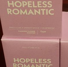 three pink boxes stacked on top of each other with the words homeless romantic written on them