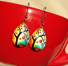 Polish Folk Art Tree themed handmade glass earrings. Artistic, colorful earrings. Perfect gift and choice for any occasion. Great Gift for Art Lovers, Folk Art enthusiast. Measures 0.98 inches in length and 0.70 inches in width. Comes with First Class Free shipping. Colors may vary due to monitor and lighting differences. Polish Folk Art, Polish Folk, Art Enthusiast, Art Tree, Earring Tree, Gifts For Art Lovers, Boho Gifts, Colorful Earrings, Earrings Unique