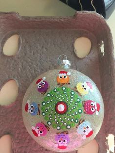 a christmas ornament with owls on it