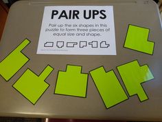 there is a sign on the table that says pair ups and two pieces of equal size and shape