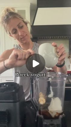 a woman is making something in a blender with the words greek yogurt on it