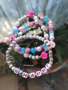 "It is a motivational stack bracelet for girls with the word \"B.Happy\". The colourful set of 3 bracelets is a mood uplifting, making it a perfect accessory for summertime outfit." Bracelets Summer, Motivational Bracelets, Kids Bracelet, Bracelet For Girls, Summertime Outfits, Rave Accessories, Stack Bracelet, Kids Bracelets, Summer Bracelets