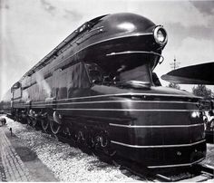 an old black and white photo of a steam locomotive