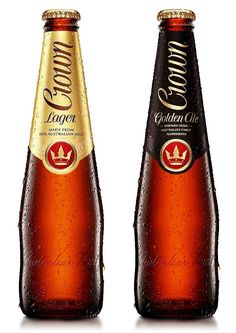 two bottles of golden club beer with water droplets on the top, and one is empty