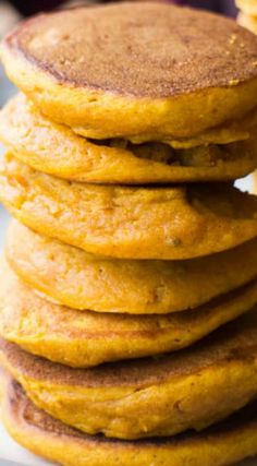 a stack of pancakes sitting on top of a white plate