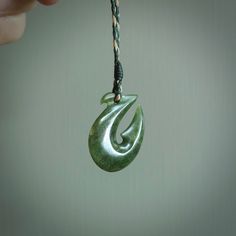 TWILIGHT BEAUTY - named after a favourite trout fly, this is a gorgeous pendant. We've designed this small - perfect for children, or anyone who would like something petite and striking. A lovely little jade hook that nicely symbolises the respected matau. These are carved from a lovely New Zealand flower jade and make a wonderful little gift - or a great matching pair for friends. The Hei-Matau is a powerful symbol representing prosperity, abundance and fertility. It also is believed to provide Unique Jewelry With Fish Hook For Gift, Jade Jewellery, Flower Jade, Hook Necklace, Hook Design, Art To Wear, Jade Jewelry, Unique Pendant, Fertility