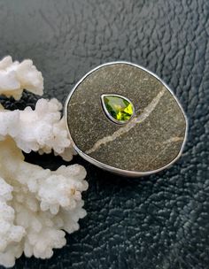 Please contact me if you want me to fabricate a similar ring. A large beach rock from the shore of northern California is inlaid with a beautiful peridot. Custom made for Alex. Pebble Jewelry, Beach Rocks, Peridot Ring, You Want Me, Raw Stone, Custom Bracelets, Multi Stone Ring, Multi Stone, Northern California