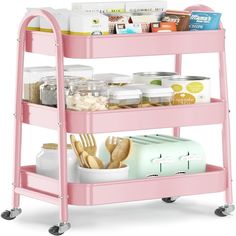 a pink cart with food and utensils on it