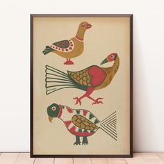 three birds are depicted in an art print on a wall above a wood flooring plank