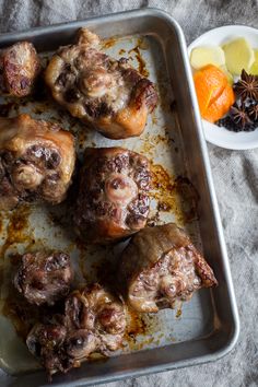 a pan filled with meat covered in sauce