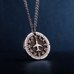 "Airplane Heading Indicator Necklace. Introducing our personalized round unisex pendant - a unique and thoughtful gift for Cabin crew, Flight attendants, adventure and travel lovers. The pendant features a captivating image of a Heading Indicator and aircraft. The Heading Indicator represents direction and guidance, reminding the wearer to follow their path and stay true to themselves. Crafted with high-quality jewelry stainless steel, this pendant is not only stylish, but also durable - suitable for pilot, aviation enthusiasts, commuters, adventures, backpackers, and anyone who loves the great travel. The personalized round pendant is a men's necklace that makes a perfect gift for dad, husband, or guy, whether for Father's Day, his birthday, or any other special occasion. A pendant with n Personalized Adjustable Jewelry For Travel, Engraved Pendant Necklace Souvenir, Engraved Round Pendant Jewelry For Souvenir, Engraved Round Pendant Jewelry As Souvenir, Personalized Silver Round Medallion Necklace, Sterling Silver Round Pendant Medallion Necklace As Gift, Gift Compass Design Round Pendant Medallion Necklace, Compass Design Medallion Pendant Necklace Gift, Compass Design Medallion Necklace Gift