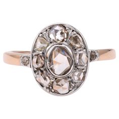 One Edwardian Diamond 14k Rose Gold Silver Cluster Ring. Featuring one rose cut diamond weighing approximately 0.20 carat, graded J color, I1 clarity. Accented by 10 rose cut diamonds with a total weight of approximately 0.90 carat, graded near-colorless, SI-I clarity. Crafted in 14 karat rose gold with a silver top. Circa 1905. The ring is a size 7 ¾ and may be resized. About this Item: Step back in time and embrace the elegance of the Edwardian era with this stunning one-of-a-kind diamond cluster ring. Featuring a mesmerizing rose cut diamond center stone and surrounded by a halo of ten additional sparkling rose cut diamonds, this ring is a true masterpiece. Crafted in 14 karat rose gold with a silver top, it exudes charm and timeless beauty. Imagine the admiration you'll receive as you Edwardian Cluster Ring, Sparkling Rose, One Rose, Silver Tops, Edwardian Era, Diamond Cluster Ring, Diamond Cluster, Rose Cut Diamond, Cluster Ring