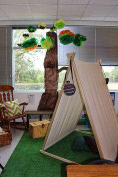 a room filled with furniture and decorations in front of a window