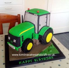 a cake shaped like a tractor on top of a table