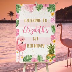 a flamingo standing next to a sign that says welcome to elizabeth's 1st birthday