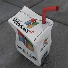 a small cart sitting on the side of a road with windows xp logo on it