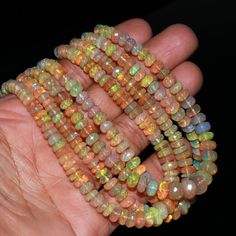 Natural Ethiopian Opal Bead 5-8 mm Faceted Rondelle Welo Fire Ethiopia Opal Beads 100 % Natural Ethiopian Opal Beads Bracelet Jewelry  ♦ W H I T E    E T H I O P I A N   O P A L   ♦ * Stone : White Opal                               * Style : Faceted  * Shape: Rondelle                        * Beads Size : 5 - 8   mm  * Length : 16 inch ( Full Strand )                                                           * Quality: AAA+ Grade High Quality Ethiopian opals are believed to possess spiritual qualities such as enhancing intuition, promoting emotional healing, and connecting with higher realms. They can bring about a sense of joy, inspiration, and spiritual awakening.   ♦ S P E C I F I C A T I O N S ♦ * All our stones are natural  * We make our jewelry with passion and love * Our Unique des Earthy Jewelry, Opal Beads, Christmas Jewelry, Beads Bracelet, Emotional Healing, White Opal, Bracelet Jewelry, Spiritual Awakening, Ethiopian Opal