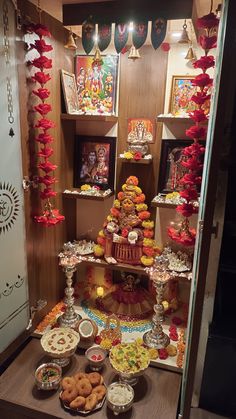 a display case filled with lots of different foods and desserts on top of wooden shelves